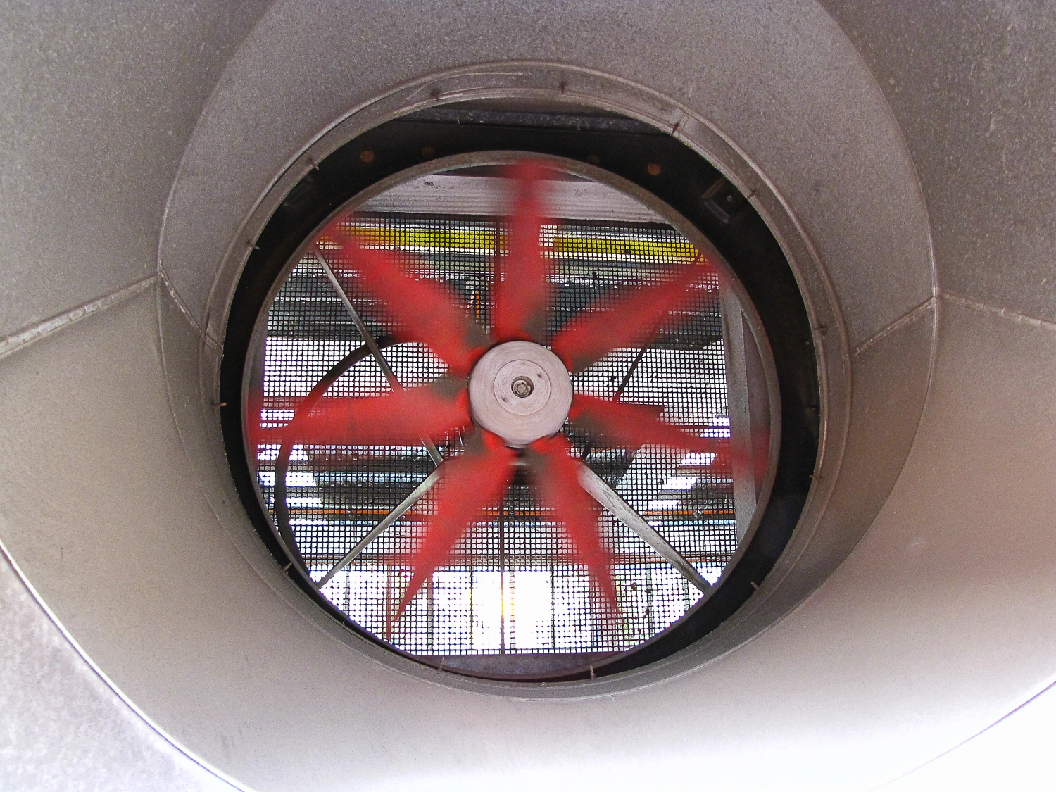 Spinning fan inside metallic ductwork